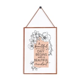 Framed floral quote print hanging by a chain
