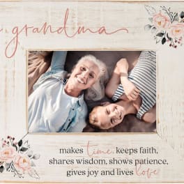 Wooden photo frame with floral accents and a grandmother photo