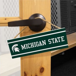 Michigan State sign hanging from a door handle
