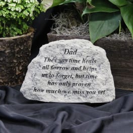 Engraved memorial stone with a message for Dad