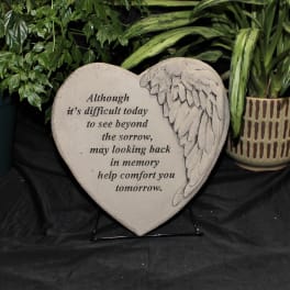 Heart-shaped memorial plaque with angel wing design and sympathy text