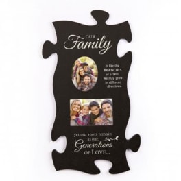 Black puzzle-piece wall plaque with family photos and white text