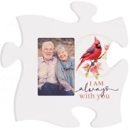 White puzzle-piece plaque with a couple's photo and a cardinal illustration