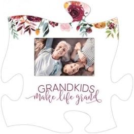 Floral puzzle-shaped photo frame with a family picture and "Grandkids make life grand" text