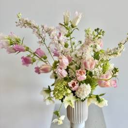Pink and white mixed bouquet in a ribbed vase