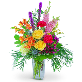 Colorful mixed bouquet in a clear glass vase