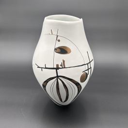Abstract white ceramic vase with black and brown geometric pattern