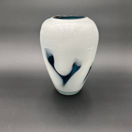 White ceramic vase with blue abstract accents