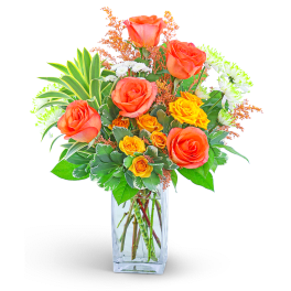 Orange and yellow roses in a clear glass vase