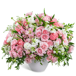 Pink and white mixed flower arrangement in a white vase