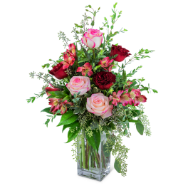 Bouquet of pink and red roses in a clear glass vase