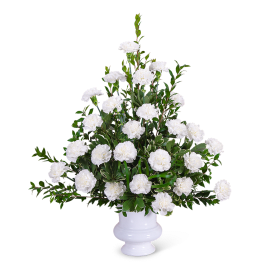 White carnation arrangement in a white urn vase