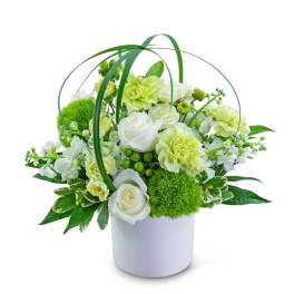 White and pale green floral arrangement in a white bucket