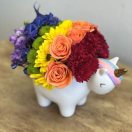 Rainbow bouquet in a white unicorn planter