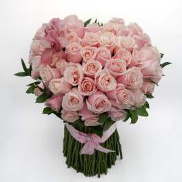 Bouquet of pale pink roses with pink orchids and a pink ribbon wrap