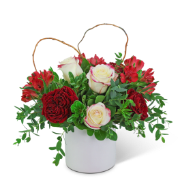 Red and white roses with red alstroemeria in a white container