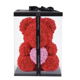 Red rose teddy bear in a clear gift box with a pink heart
