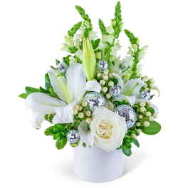 White lilies and roses in a white vase with silver disco ball accents