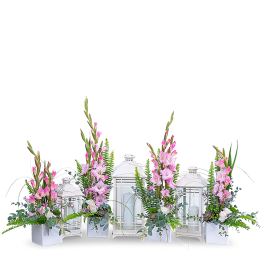 Pink floral arrangements with white lanterns
