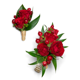Red rose boutonnieres with berries and green leaves
