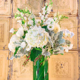 White floral arrangement in a clear glass vase