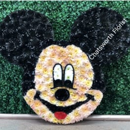Mickey Mouse face floral display with black ears and pastel flowers