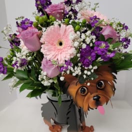 Pink and purple bouquet in a dog-shaped vase