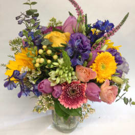 Colorful mixed bouquet in a clear glass vase