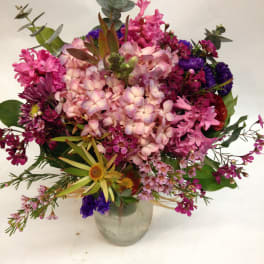 Mixed pink and purple bouquet in a glass vase