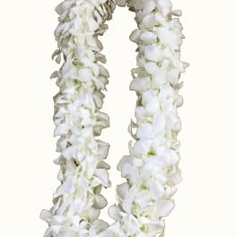 White flower lei made of clustered blossoms