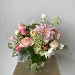Pink and white mixed bouquet in a clear glass vase