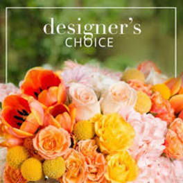 Mixed bouquet of orange, yellow, and pale pink flowers