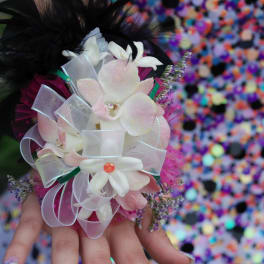 Handheld corsage with white and pale pink flowers and ribbon