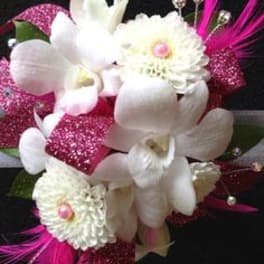 White orchids and daisies with bright pink accents on a black background
