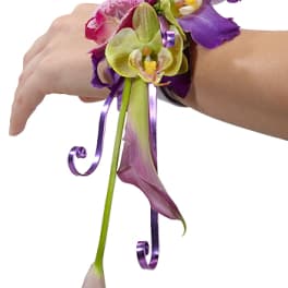 Purple and green orchid wrist corsage with ribbon curls