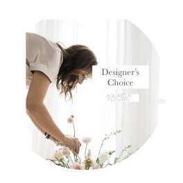 Woman arranging a pastel flower bouquet with "Designer’s Choice" text