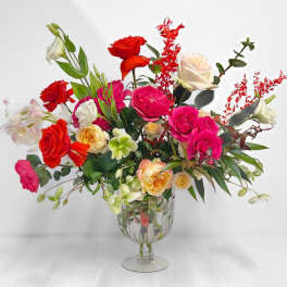 Colorful rose arrangement in a clear glass vase