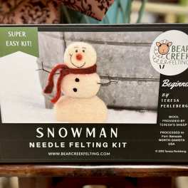 Boxed snowman needle felting kit with a felt snowman on the front