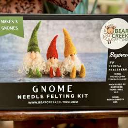 Boxed gnome needle felting kit with three felt gnomes pictured