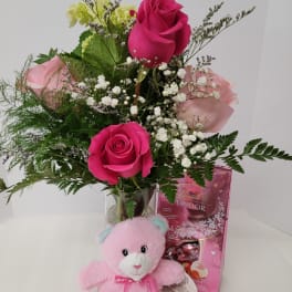 Pink rose bouquet with a teddy bear and chocolate gift box