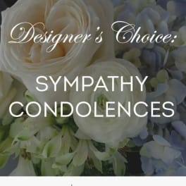 White floral sympathy arrangement with roses and hydrangeas