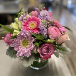 Pink and lavender mixed bouquet in a glass vase