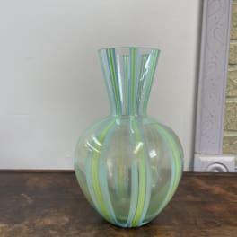 Striped glass vase with a rounded body and flared neck