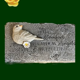 Decorative memorial plaque with a bird and a yellow rose