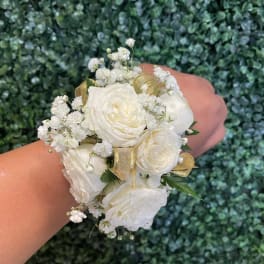 White rose wrist corsage with baby's breath and gold ribbon