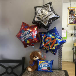 Birthday balloons with a teddy bear and Oreo cookies