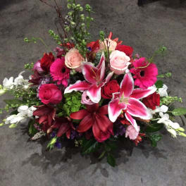 Mixed bouquet with pink and red roses, lilies, and gerbera daisies