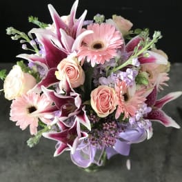 Pink and white mixed bouquet with lilies, roses, and gerbera daisies