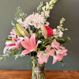 Pink and white mixed bouquet in a clear glass vase