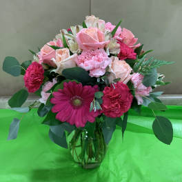 Pink mixed bouquet in a clear glass vase